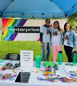 Gaybrielle and 2 other employees at an Enterprise Pride Booth